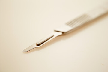 A surgical scalpel on a white background