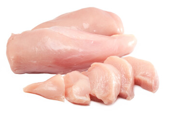 Fresh raw chicken breast fillet whole and sliced isolated closeup on white background, clipping path