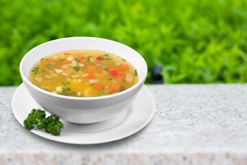 Bowl of delicious vegetable soup on a table