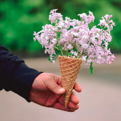 hand holding flowers