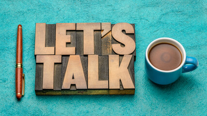 Let us talk invitation  - text in vintage letterpress wood type block with a cup of coffee, discussion and communication concept
