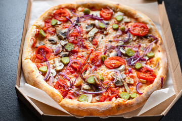 pizza vegetable tomato, pickles, mushrooms vegan or vegetarian no meat on the table healthy snack top view copy space food background rustic 