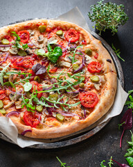 pizza vegetable tomato, pickles, mushrooms vegan or vegetarian no meat on the table healthy snack top view copy space food background rustic 
