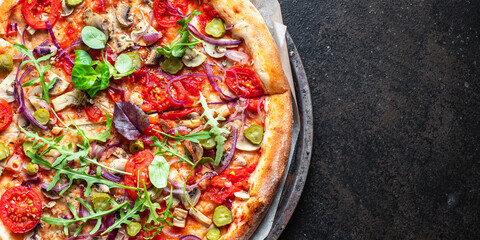 pizza vegetable tomato, pickles, mushrooms vegan or vegetarian no meat on the table healthy snack top view copy space food background rustic 