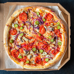pizza vegetable tomato, pickles, mushrooms vegan or vegetarian no meat on the table healthy snack top view copy space food background rustic 