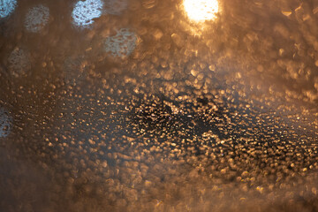 Blurred background with raindrops and lights.