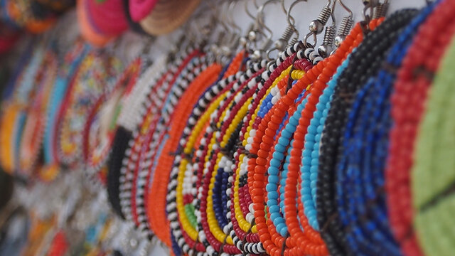 Close up of colourful beaded earrings, popular African jewelry.