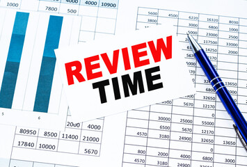 Text REVIEW TIME on financial tables, the working paper . Business and financial conzept.