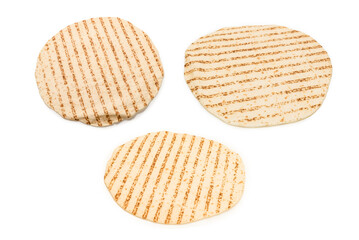Grilled pitta bread isolated on white background.