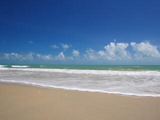 Beautiful tropical sea and sand beach with blue sky in sunny day