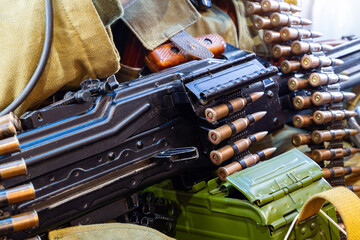 Machine-gun belt with equipment on a soldier during the war. Military action in the world.