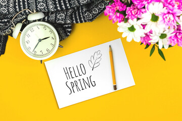 Hello Spring mockup workspace or desktop with yellow background and bouquet of flowers