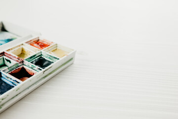 Watercolor in a box on the white background