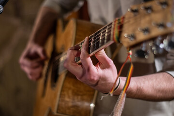 Hippie strumming an acoustic guitar