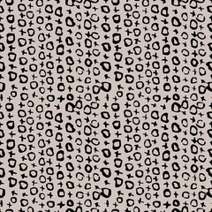 Fototapeta na wymiar Seamless pattern with black noughts and crosses on a beige background.