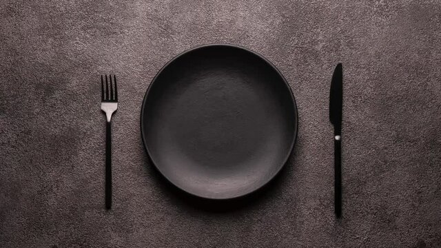Plate on a gray dynamic floating background, special wave effect on the bottom of the black plate