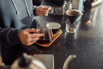 Happy smiling professional barista in cafe