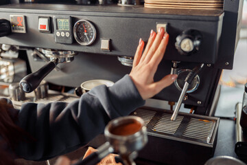 Happy smiling professional barista in cafe