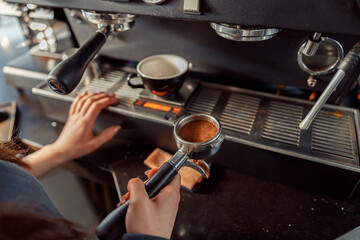 Happy smiling professional barista in cafe
