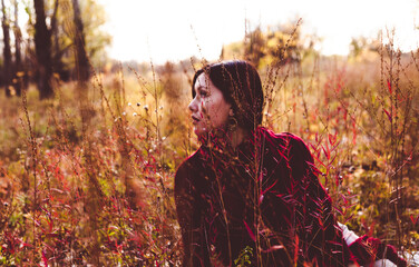 Vintage lady hiding in grass - 414746047