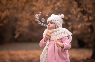 Girl, garden, pink coat, soap bubble blower, fun
