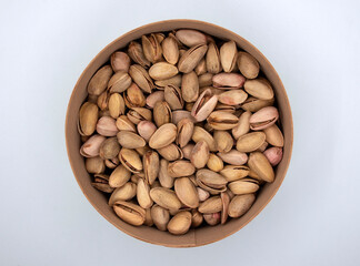 Salted pistachios in a round box