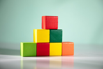 Top view of wooden colorful cubes.