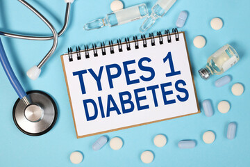 types 1 Diabetes. text on white paper in notebook near stethoscope and ampoules