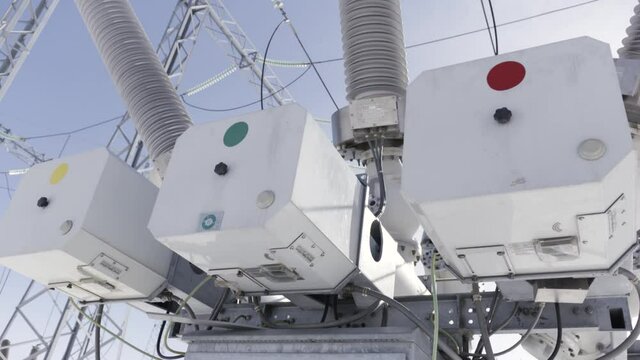 High voltage transformer at the power station. Action. Power generation systems connected to the city, important technology of electricity.