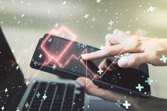 Creative abstract heart pulse hologram and finger presses on a digital tablet on background, online medical consulting concept. Multiexposure