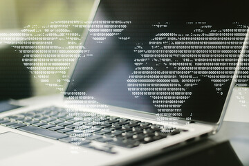 Double exposure of abstract digital world map on laptop background, research and strategy concept