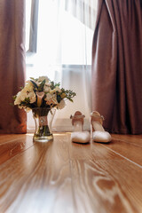 wedding bouquet and bride's shoes