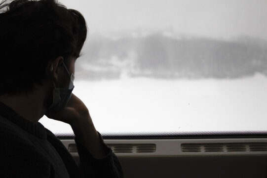 Thinking Person Looking Out The Train Window, Young Man Look At Winter Landscape From Train Window, Businessman In Covid Mask Travel By Train, Alone Sad Men In Train