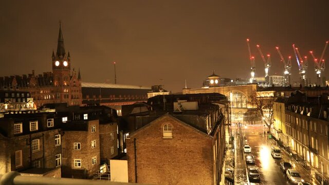 London King's Cross Station time lapse from day to night with clouds moving night city lights