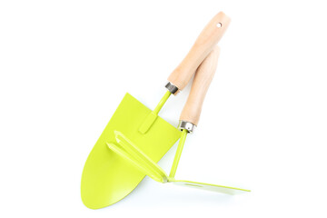 Garden shovel and rake isolated on white background