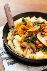 Lentil Stew with kale, carrots and mushrooms on mashed potatoes.
