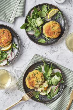 Smoked mackerel fishcakes served with a rocket, spinach salad