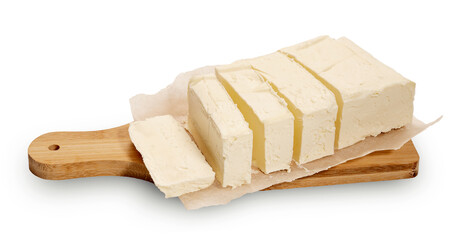 block of sandwich light cut butter on a cutting board on a white background