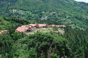 house in the mountains surrounded by nature