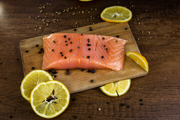 Raw salmon fish fillet with lemon