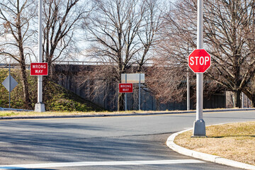 Stop wrong way street signs decision concept