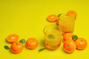 Sweet fruit jelly from fresh oranges and tangerines on summer yellow background