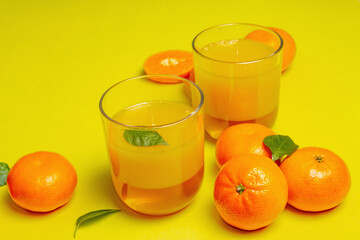 Sweet fruit jelly from fresh oranges and tangerines on summer yellow background