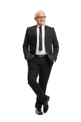 Full length portrait of a mature businessman smiling and posing with hands in pockets
