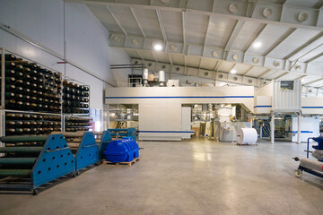 Big warehouse with paper rolls and printing material