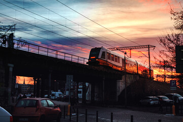 railway at beautiful sunset with train