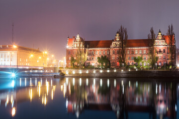 view of the river and buildings on the banks of the odra river in wroclaw in poland