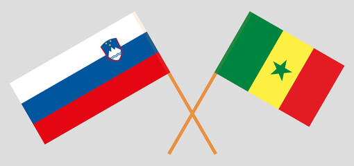 Crossed flags of Slovenia and Senegal