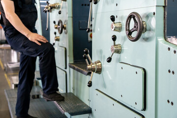 close up engineer hand finger press button controling cnc machine, Workers operating factory machinery in warehouse