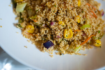 Sicilian recipe vegetable Tabulè, a salad based on cold couscous seasoned with lots of vegetables
